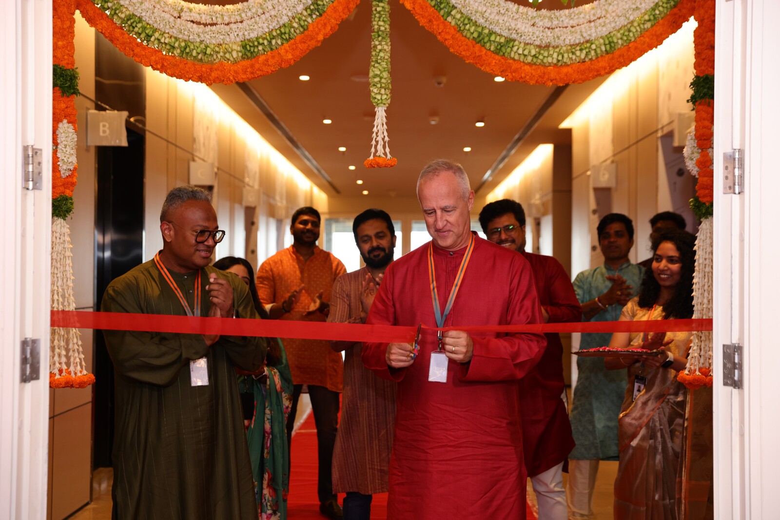 TDCX Founder and CEO Laurent Junique (center) cuts the ribbon at the company's second Hyderabad campus at Meenakshi Eco Park, joined by Group CIO and EVP Byron Fernandez and India Country Director Ananth Premkumar, August 20, 2026.
