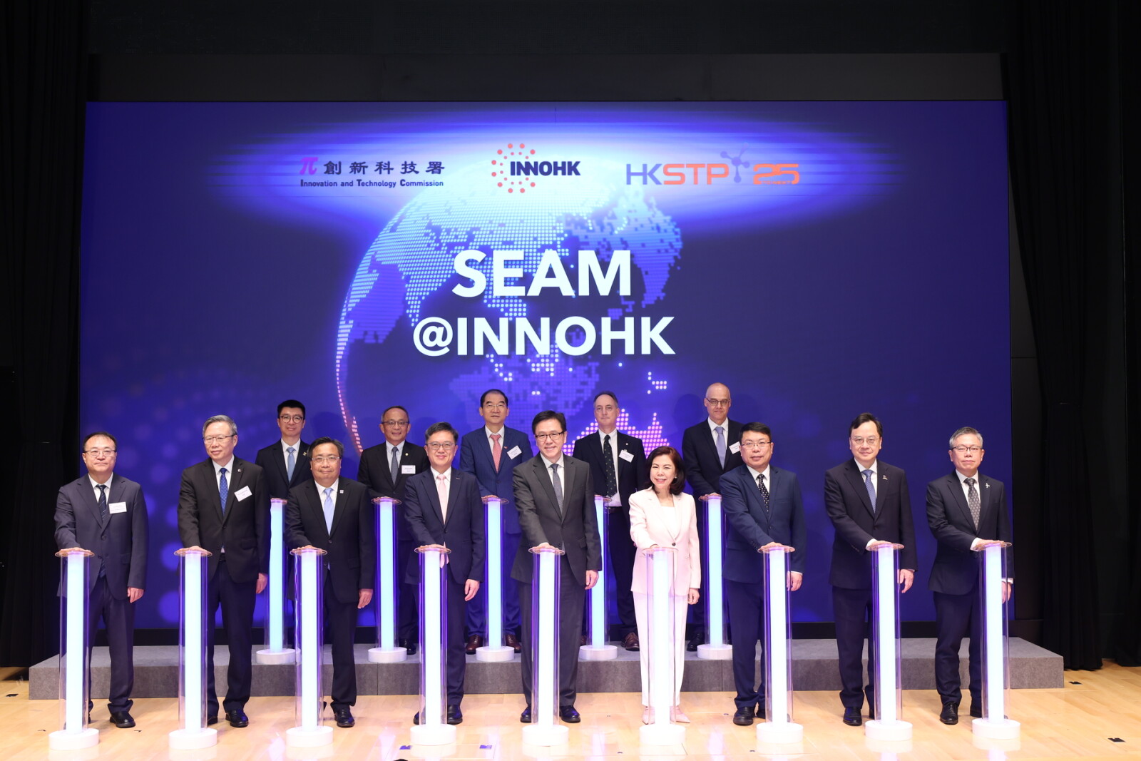Officiating guests at the Launch Ceremony included Professor Sun Dong, Secretary for Innovation, Technology and Industry (front row, centre); Ms Cordelia Chung, Chairman of HKSTP (front row, 4th from right); Mr Kelvin Choi, Permanent Secretary for Innovation, Technology and Industry (front row, 4th from left); Mr Lyu Feng, Deputy Director-General of the Economic and Financial Department II of the Liaison Office of the Central People's Government in the HKSAR (front row, 3th from right); Mr Ivan Lee, Commissioner for Innovation and Technology (front row, 3th from left); and Mr Terry Wong, Chief Executive Officer of HKSTP (front row, 1st from right).