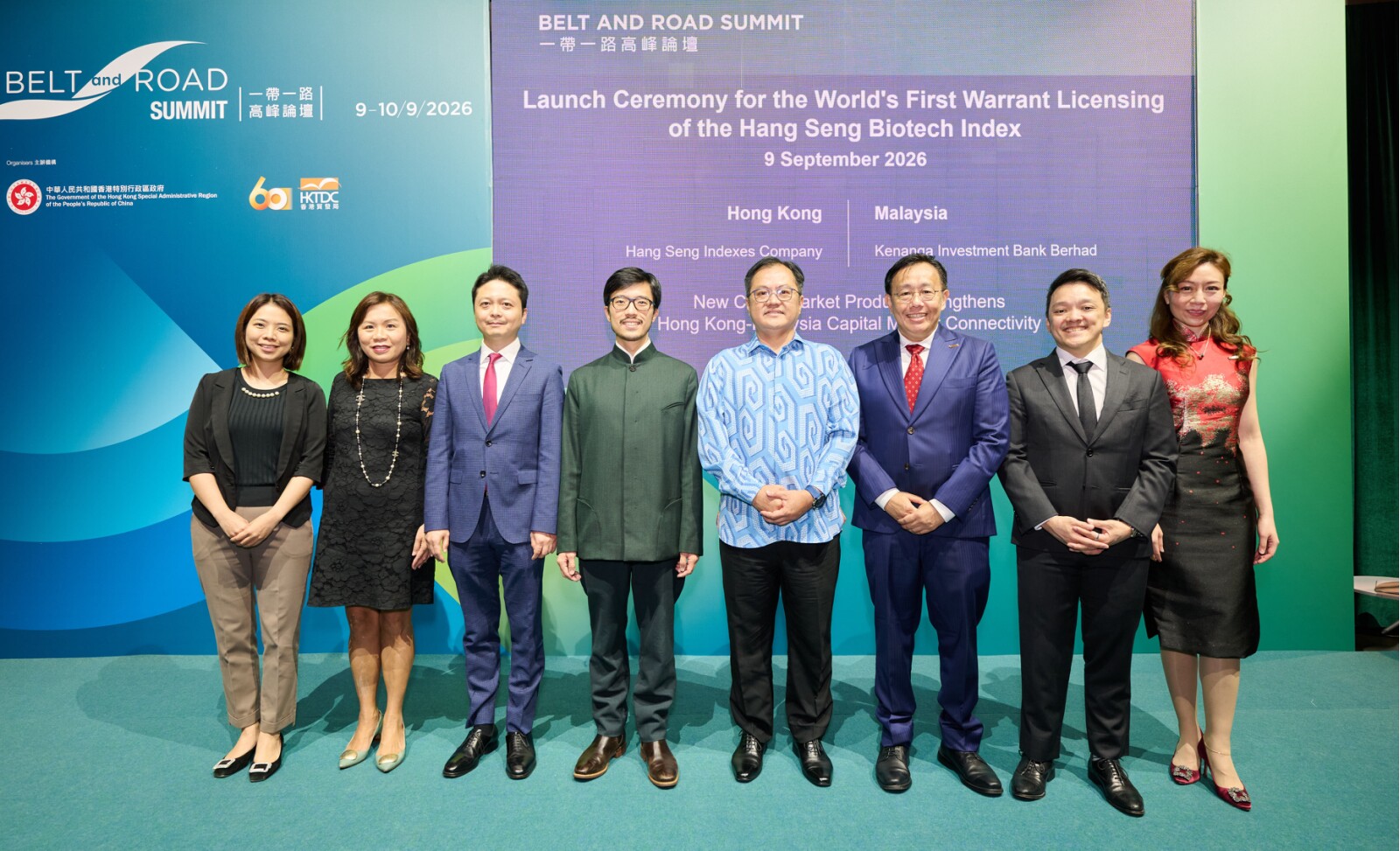 (From left to right) Nancy Cheng, Executive Director and Head of Operations of Hang Seng Indexes Company; Linda Luk, Executive Director and Product Strategist (ETF) of Hang Seng Indexes Company; Gilbert Lee, Executive Chairman of Hang Seng Indexes Company; Nicholas Ho, Commissioner for Belt and Road of the HKSAR Government; Muzambli Markam, Consul General of Malaysia in Hong Kong SAR and Macao SAR; Philip Lim, Head of Equity Markets and Group Head of Equity Derivatives of Kenanga Investment Bank Berhad ("KIBB"); Kenneth Teoh, Deputy Head of Equity Derivatives and Head of Equity Derivatives Trading of KIBB, and Isabelle Zhen, Head of Group Equity Marketing of KIBB